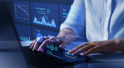 Analyst working with dashboards on a laptop